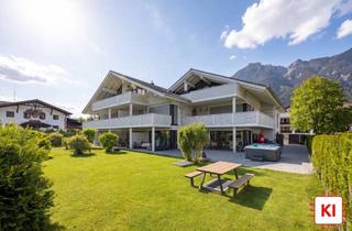 Wohnung kaufen in 82467 Garmisch-Partenkirchen, Luxuriöse, großzügige 7-Zimmer-Gartenwohnung mit Spa-Möglichkeit im Souterrain