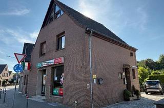Haus kaufen in 41472 Neuss, Neuss - Wohn- und Geschäftshaus mit vermietetem Ladenlokal und großzügige