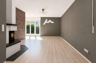 Wohnung kaufen in 60488 Praunheim, Stadtkomfort trifft Gartenglück: Charmante Wohnung mit Kamin