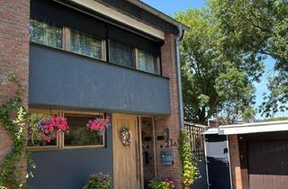 Haus kaufen in 47551 Bedburg-Hau, Charmantes Split-Level-Haus mit Garage auf 660 m² Grundstück