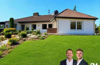 Haus kaufen in 86441 Zusmarshausen, Wohnen im Grünen mit bester Anbindung: Bungalow mit Kamin, Wintergarten, Teich & idyllischem Garten