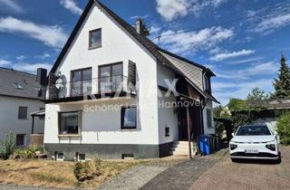 Mehrfamilienhaus kaufen in 55491 Büchenbeuren, Mehrfamilienhaus mit drei Wohneinheiten, Garten und Garage