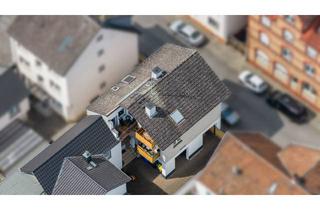 Mehrfamilienhaus kaufen in 65474 Bischofsheim, Voll vermietetes 3-Familienhaus mit Garage auf WEG-geteiltem Grundstück *Verkauf im Bieterverfahren*