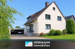 Haus kaufen in 31867 Hülsede, Wohnen mit Aussicht – Charmantes Zweifamilienhaus auf großzügigem Grundstück
