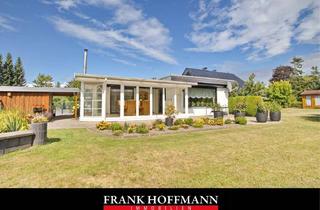 Haus kaufen in 24629 Kisdorf, Gut geschnittener Bungalow mit Wintergarten und Carport auf schönem Grundstück in Kisdorf