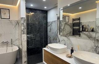 Wohnung kaufen in 61137 Schöneck, Schöneck - Designbad, Kamin & Kochinsel: Exklusive Eigentumswohnung