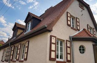 Doppelhaushälfte kaufen in 06766 Bitterfeld-Wolfen, Charmante Doppelhaushälfte mit großem Grundstück und ausbaufähigem Dachgeschoss