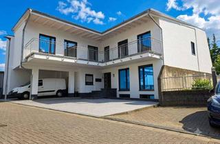 Mehrfamilienhaus kaufen in Mühlweg, 35606 Solms, Modernes Mehrfamilienhaus mit drei Wohneinheiten