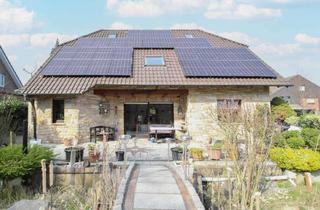 Haus kaufen in 33378 Rheda-Wiedenbrück, Exklusives EFH mit Bruchsteinfassade, Carport und PV-Anlage in Rheda