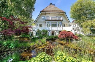 Wohnung kaufen in 82131 Gauting, Stilvolle Maisonette-Wohnung mit Haus-im-Haus-Charakter und Traumgarten