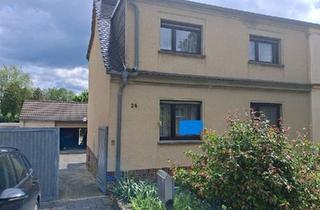 Doppelhaushälfte kaufen in 06774 Muldestausee, Muldestausee - Charmantes Wohnhaus in exponierter Lage im OT Mühlbeck