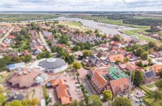 Wohnung kaufen in 26736 Krummhörn, „Deichgold“ – charmante Ferienwohnung mit offenem Wohnkonzept und Loggia in Greetsiel