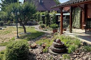 Haus kaufen in 29323 Wietze, Wietze-Wieckenberg: Blockbohlenhaus mit Charme und traumhaftem Garten