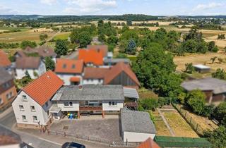Einfamilienhaus kaufen in 35447 Reiskirchen, Einfamilienhaus mit Anbau, Doppelgarage und vielseitigen Nutzungsmöglichkeiten