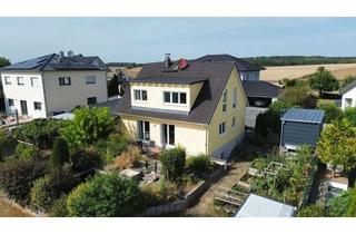 Haus kaufen in 97950 Großrinderfeld, Modernes Familienhaus mit Doppelgarage, großem Grundstück & Schwimmteich