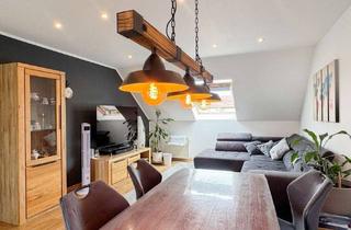 Wohnung kaufen in 64569 Nauheim, Wohnen wie im eigenen Haus: Großzügige Maisonette mit Balkon und zwei Stellplätzen