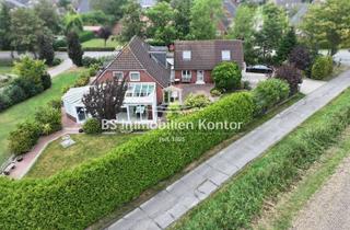 Einfamilienhaus kaufen in 26736 Krummhörn, Top gepflegtes Einfamilienhaus mit Wintergarten, Anbau und Gartenanlage in idyllischer Lage!