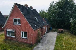 Einfamilienhaus kaufen in 26529 Upgant-Schott, Upgant-Schott - Einfamilienhaus mit großem Grundstück direkt am Kanal