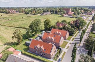 Wohnung kaufen in 26759 Hinte, Hochwertige Erdgeschosswohnung mit Sommergarten in zentraler Lage von Hinte