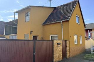 Einfamilienhaus kaufen in 67069 Ludwigshafen, Charmantes Eigenheim mit großzügigem Garten und überdachte Dachterrasse