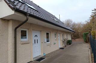Haus kaufen in 23743 Grömitz, Wohnen auf drei Ebenen: Reihenmittelhaus mit ausgebautem Dachgeschoss
