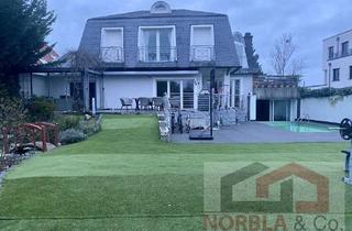 Haus kaufen in 63477 Maintal, Exklusives Zweifamilienhaus in Top-Villenlage von Maintal