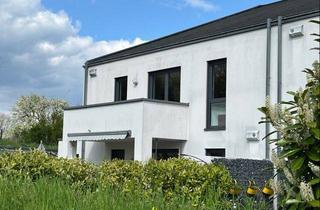 Wohnung kaufen in 54634 Bitburg, Moderne Eigentumswohnung mit hochwertiger Ausstattung und zwei Parkplätzen