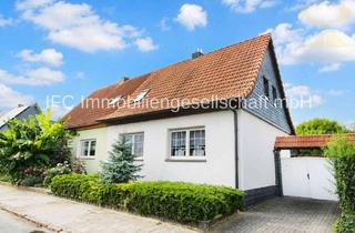 Doppelhaushälfte kaufen in 06366 Köthen, Doppelhaushälfte mit modernisierter Heizung, Kamin, Sauna und idyllischem Garten in Köthen (Anhalt)