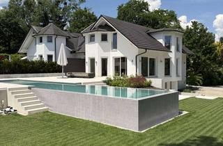 Haus kaufen in Eisvogelweg 24, 86938 Schondorf, Tolles Haus mit Infinity Pool 15 × 3 m mit einem kleinen See und Bergblick