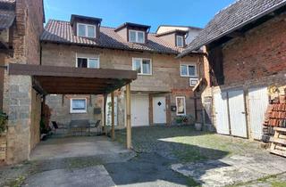 Mehrfamilienhaus kaufen in Hauptstraße 5a, 35463 Fernwald, Mehrfamilienhaus mit vermieteter Einliegerwohnung, Ausbaupotenzial und großem Garten in Fernwald
