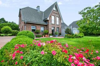 Einfamilienhaus kaufen in 24369 Waabs, Einfamilienhaus mit Einliegerwohnung, Doppelgarage und blühendem Garten nahe der Ostsee