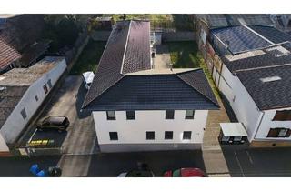 Mehrfamilienhaus kaufen in 35428 Langgöns, Attraktives Anlageobjekt: Modernisiertes Mehrfamilienhaus mit 3 Wohneinheiten in Langgöns