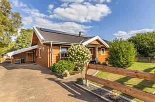 Haus kaufen in 26842 Ostrhauderfehn, Natürlich wohnen, modern leben – Energieeffizientes Holzhaus in Wasserlage !