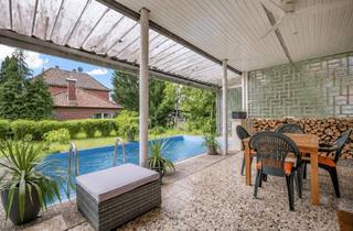 Haus kaufen in 29690 Schwarmstedt, Bungalow auf großem grünen Grundstück mit Pool