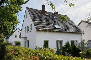 Haus kaufen in 65428 Rüsselsheim, Freistehendes Zweifamilienhaus mit großem Süd-West Garten in naturnaher Wohnrandlage
