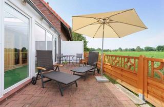 Mehrfamilienhaus kaufen in 26409 Wittmund, Ein Mehrfamilienhaus mit zusätzlichen Ferienwohnungen in Sackgassenlage mit Deichblick zu verkaufen!