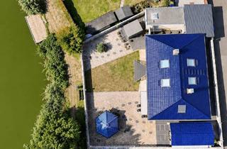 Haus kaufen in 61203 Reichelsheim, WOHNEN, WO ANDERE URLAUB MACHEN – außergewöhnliches Haus direkt am See bei Friedberg