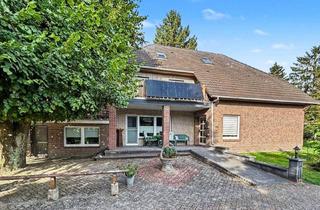 Haus kaufen in 26676 Barßel, Attraktives Ein- oder Zweifamilienhaus mit Garagen auf ca. 1,13 Hektar großem Grundstück in Barßel