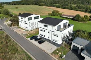 Wohnung kaufen in 63584 Gründau, Gründau - 4,5% Rendite Moderne 2-Zimmer-Wohnung mit Terrasse in Feldrandlag