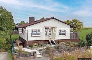 Haus kaufen in 61184 Karben, Teilsanierter Bungalow am Feldrand – Wohnen auf einer Ebene mit Weitblick