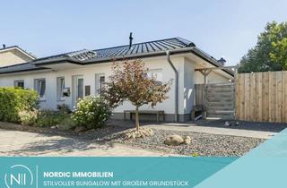 Haus kaufen in 24644 Timmaspe, Modernes Wohnen auf einer Ebene – stilvoller Bungalow mit großzügigem Grundstück