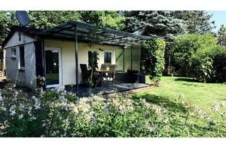 Haus kaufen in 10178 Berlin, Berlin - Wochenendhaus mit Garten auf Eigentumsland in Seenähe
