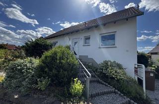 Einfamilienhaus kaufen in 34466 Wolfhagen, Gepflegtes Wohnhaus mit drei Wohneinheiten, Garten, Terrassen und Garage in Wolfhagen