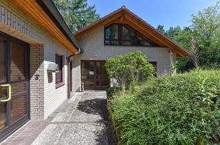 Haus kaufen in Algenweg 32, 29633 Munster, Winkelbungalow mit rollstuhlgerechtem Anbau, Kamincharme & grüner Oase in gehobener Lage**
