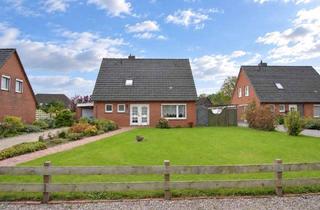 Einfamilienhaus kaufen in 25774 Lunden, Solides Einfamilienhaus mit Wintergarten und schönem Grundstück in ruhiger Wohnlage