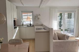 Wohnung kaufen in 63512 Hainburg, Hainburg - Modernisierte 3-Zimmer-Wohnung auf zwei Ebenen mit Südgarten