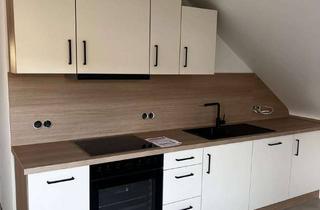 Wohnung mieten in 76646 Bruchsal, Moderne DG-Wohnung mit Blick über Bruchsal - Balkon und Einbauküche – Erstbezug nach Kernsanierung