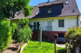 Haus kaufen in 34320 Söhrewald, Charmantes Zweifamilienhaus mit Traumgarten und Photovoltaik – vielseitig nutzbar!