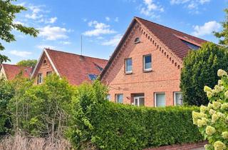 Haus kaufen in 31547 Rehburg-Loccum, Backsteincharme trifft Rendite – voll vermietetes Vierfamilienhaus mit 6 Garagen und 1 Stellplatz