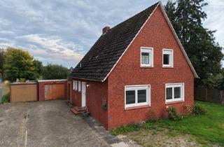 Wohnung kaufen in 26842 Ostrhauderfehn, Wohnhaus mit großzügigem Grundstück, zwei Garagen und viel Raum für eigene Gestaltungsmöglichkeiten!